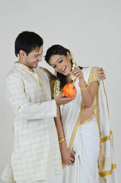 Indian man showing wife jewelry