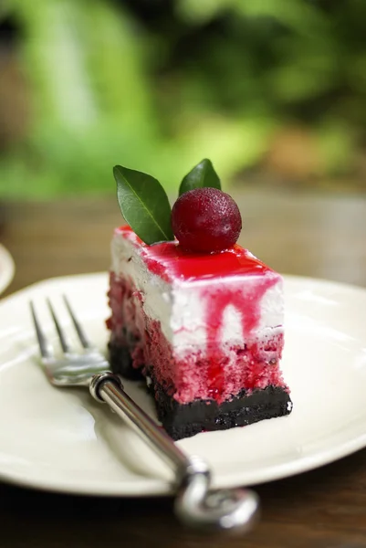 Extreme close-up image of delicious cake with cherries