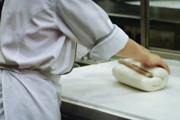 Baker making bread , woman hands , kneading a dough , cooking co