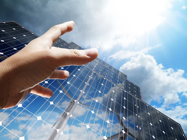 Hand reach the sun concept renewable, alternative solar energy,