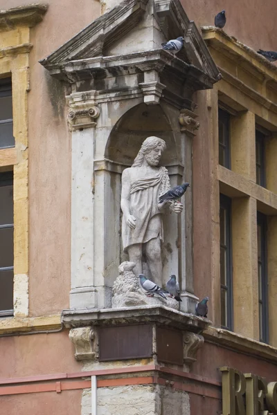Statue of jesus with lamb and live doves