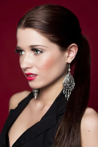 Fashionable woman with silver earrings