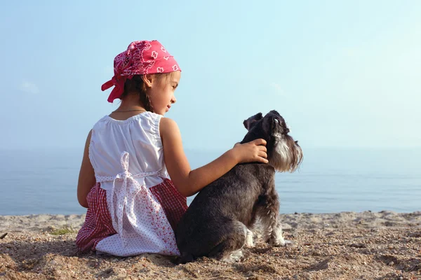Beautiful little girls with her dog