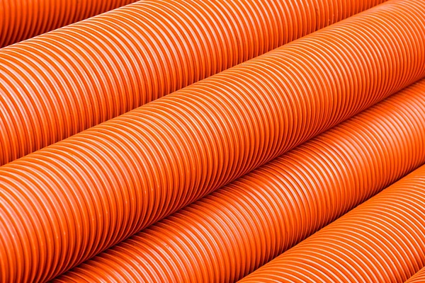 Orange plastic PVC pipes