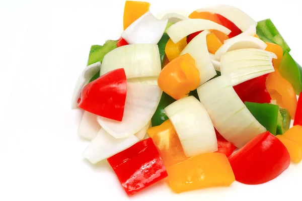Yellow , red ,and green paprika on white background