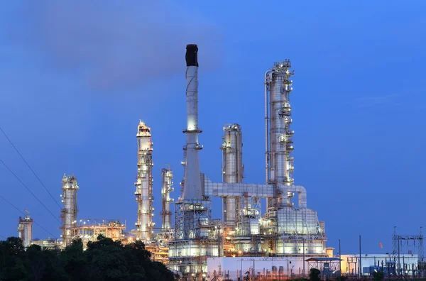 Scenic of petrochemical oil refinery plant shines at night, clos
