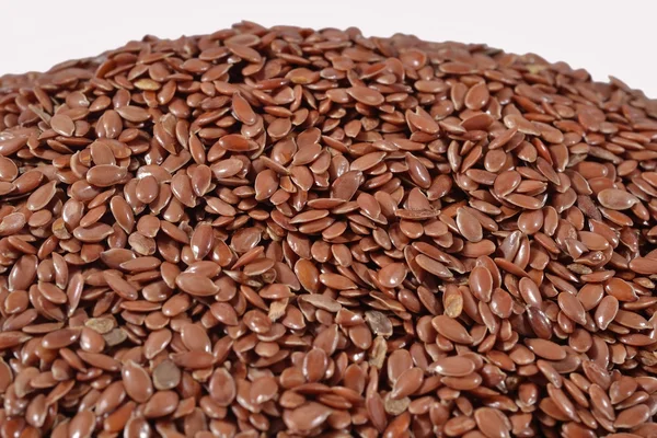 Heap of linseed on a white