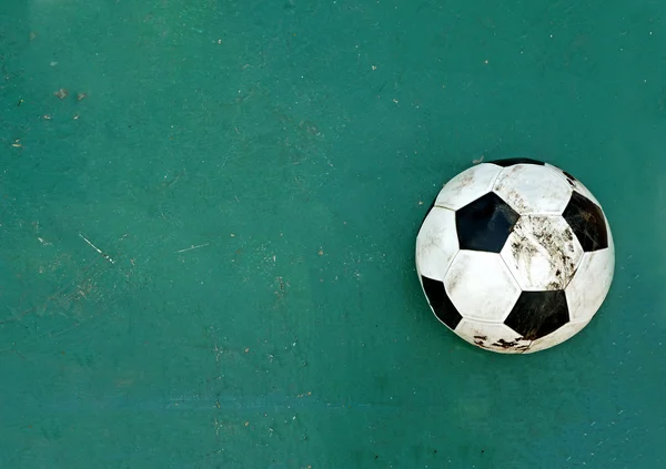 Ball on green rubber floor