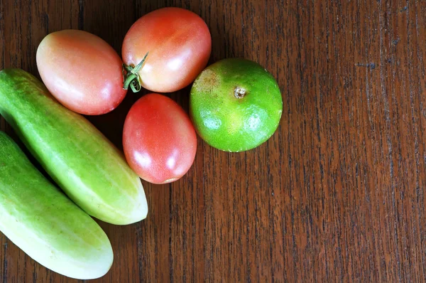 Healthy food background different fruits and vegetables on old wooden table