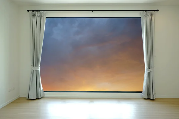 Empty room and curtain open to sky