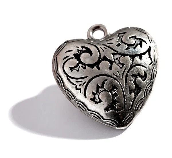 Ornate silver heart shaped locket