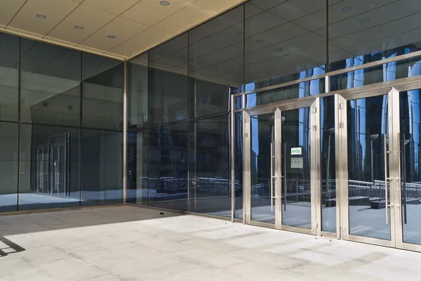 Closed doors in modern large glass building