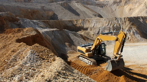 Excavator in the stone mine