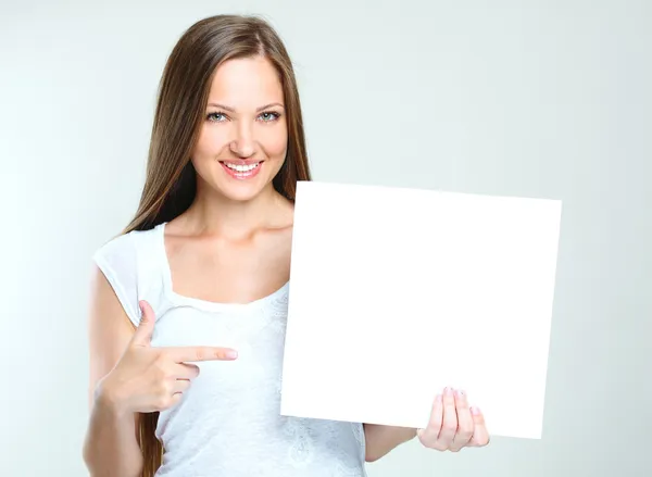 Woman holding blank paper