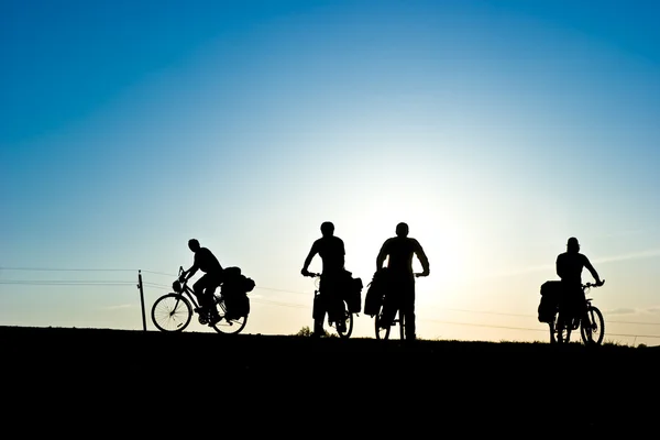 Bicycle tourists silhouette