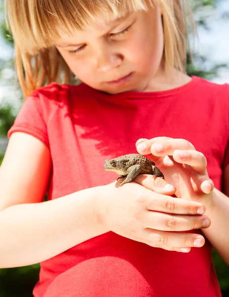 Child with frog