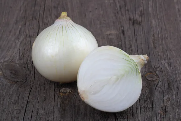 White onions on wood background