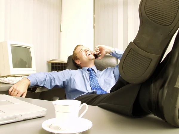 Relaxed businessman working in office