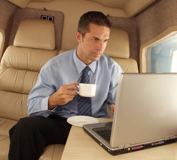 Business man working at private jet.