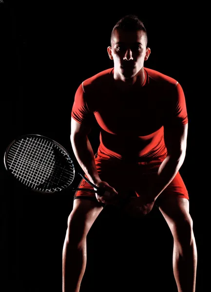 Tennis player on black background.