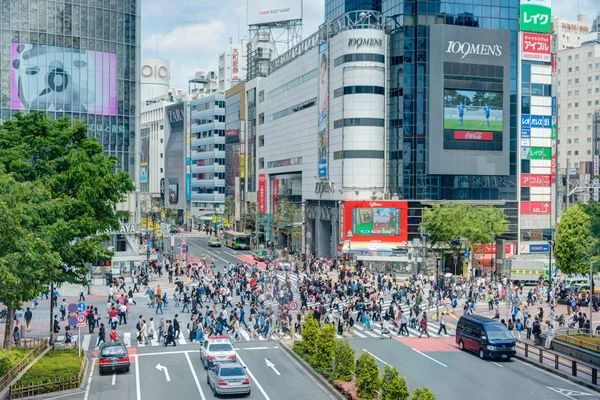 TOKYO, JAPAN - May 1 2014: Shibuya crossing is one of the most famed examples of a scramble crosswalk in the world.