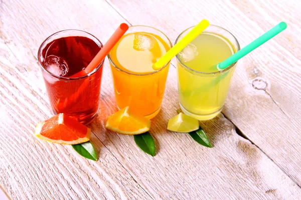 Citrus juices in glass from grapefruit, oranges, lime