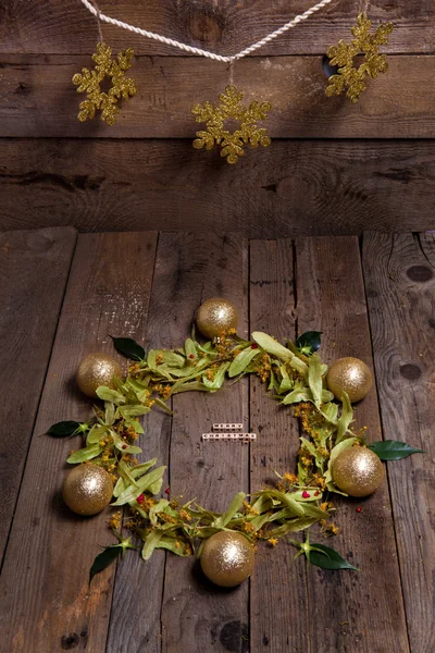 Christmas composition with linden blossom on old wooden table