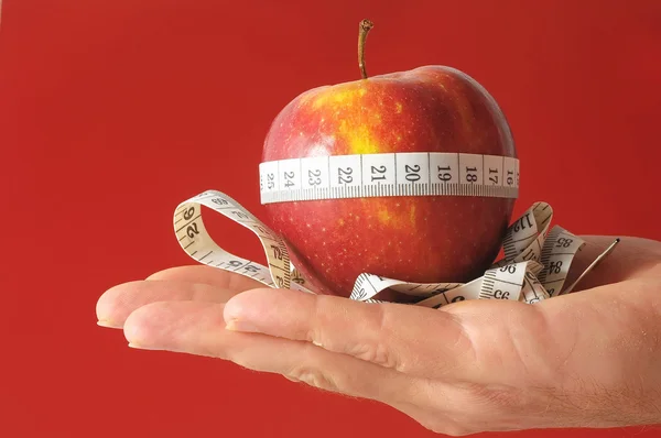 Diet Apple and Meter on the Hand