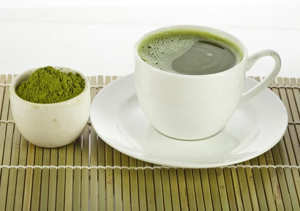 Japanese Matcha green tea in cup and tea powder