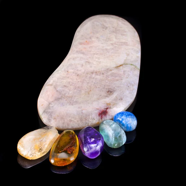 Trace foot made of natural colorful raw gem-stones