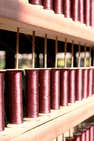 Closeup of weaving thread for the textile industry