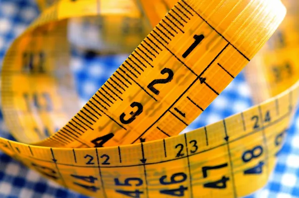 Tailor's measuring tape on fabric