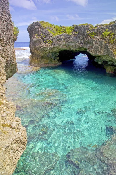 Natural arch over one of the Limu pools, Niue Island, South Pacific.