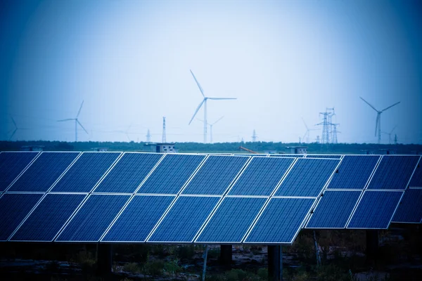 Green energy - solar panels and wind turbine.