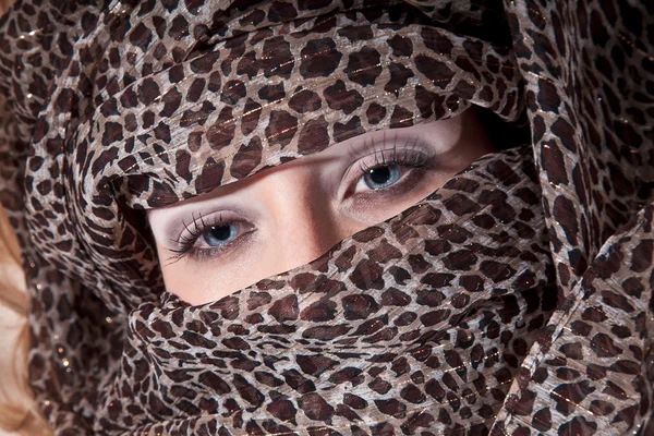Girl's face in brindle headscarf
