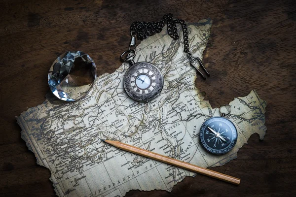 Old compass and vintage map