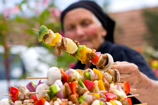 Elderly woman with fresh food