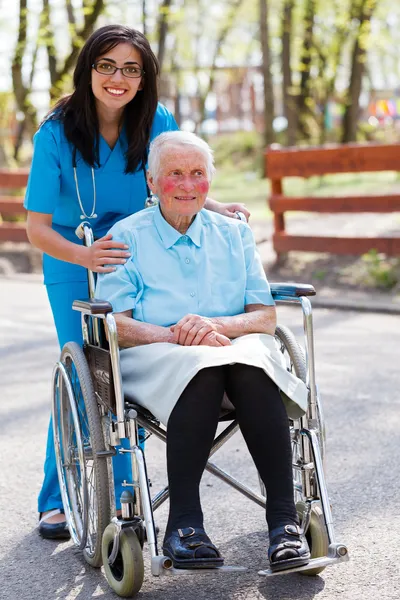 Senior Patient Talking With Kind Nurse