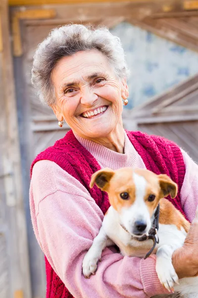 Laughing woman with puppy