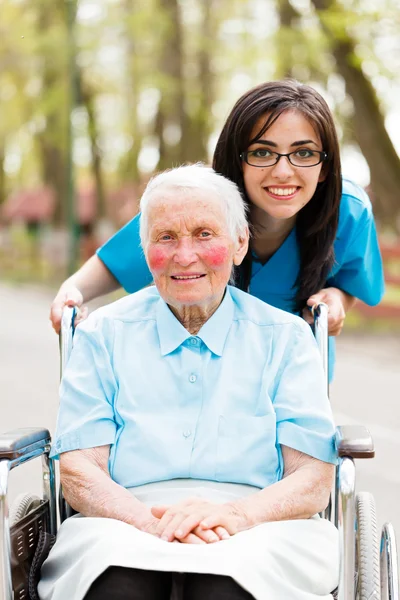 Kind Nurse and Elderly Lady