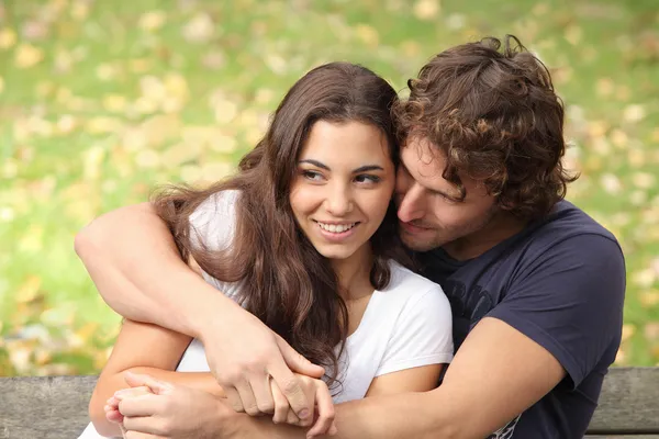 Couple hugging in a park