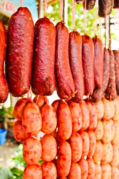 Home made meat salami sausage at street market hanging in line u