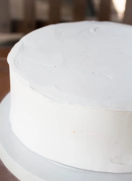 White cake base decorate with whipped cream