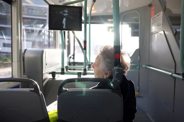 Elderly woman on the bus