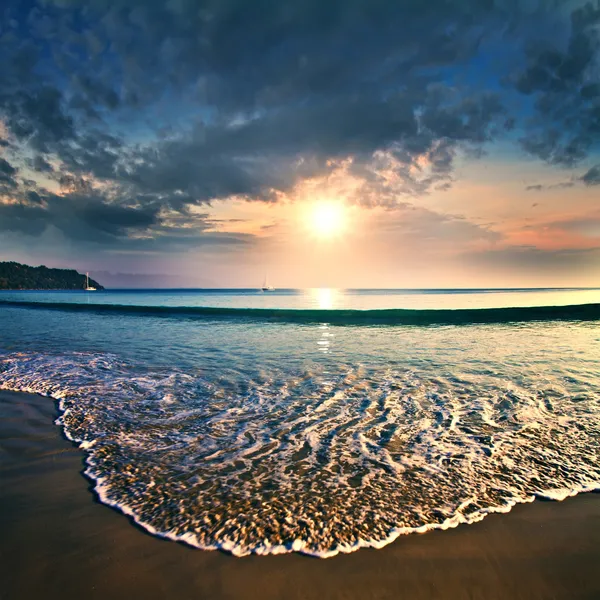Summer sea design template. Beautiful sunset on tropical beach with shorebreak and sunlight on horizon
