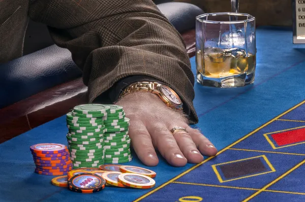 Playing in casino. Hand of a player