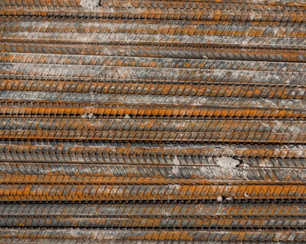 Rusty rebar steel used in construction background texture