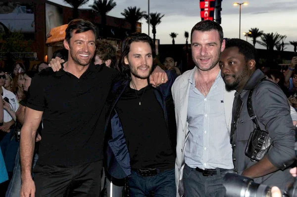 Hugh Jackman and Taylor Kitsch with Liev Schreiber and Will i Am at the United States Premiere of