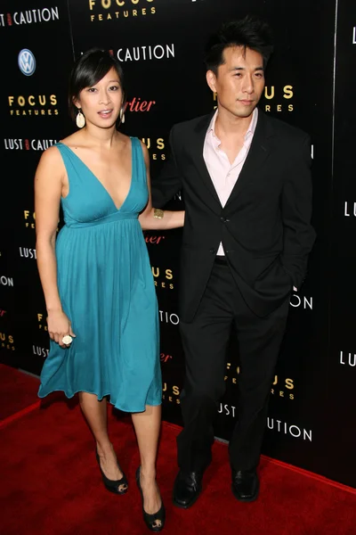 James Kyson Lee and friend at the Los Angeles Premiere of \