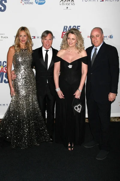 Tommy Hilfiger and Nancy Davis with guests